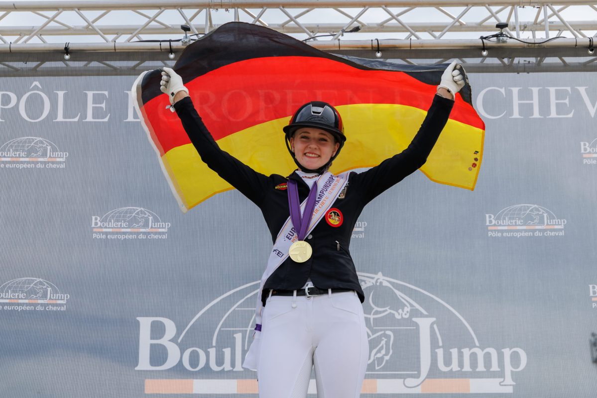 The Dressage Individual Medal Ceremony. GOLD: Leni-Sophie Gosmann (GER) and Diamantini EA WE. 2026 FEI European Championship for Ponies | Le Mans. Pôle Européen du Cheval, Le Mans, France. Saturday 1 August 2026. Copyright Photo: FEI / Libby Law Photography